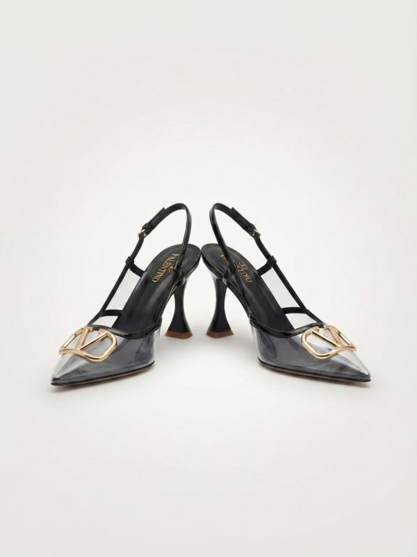 Black sandel with golden badge